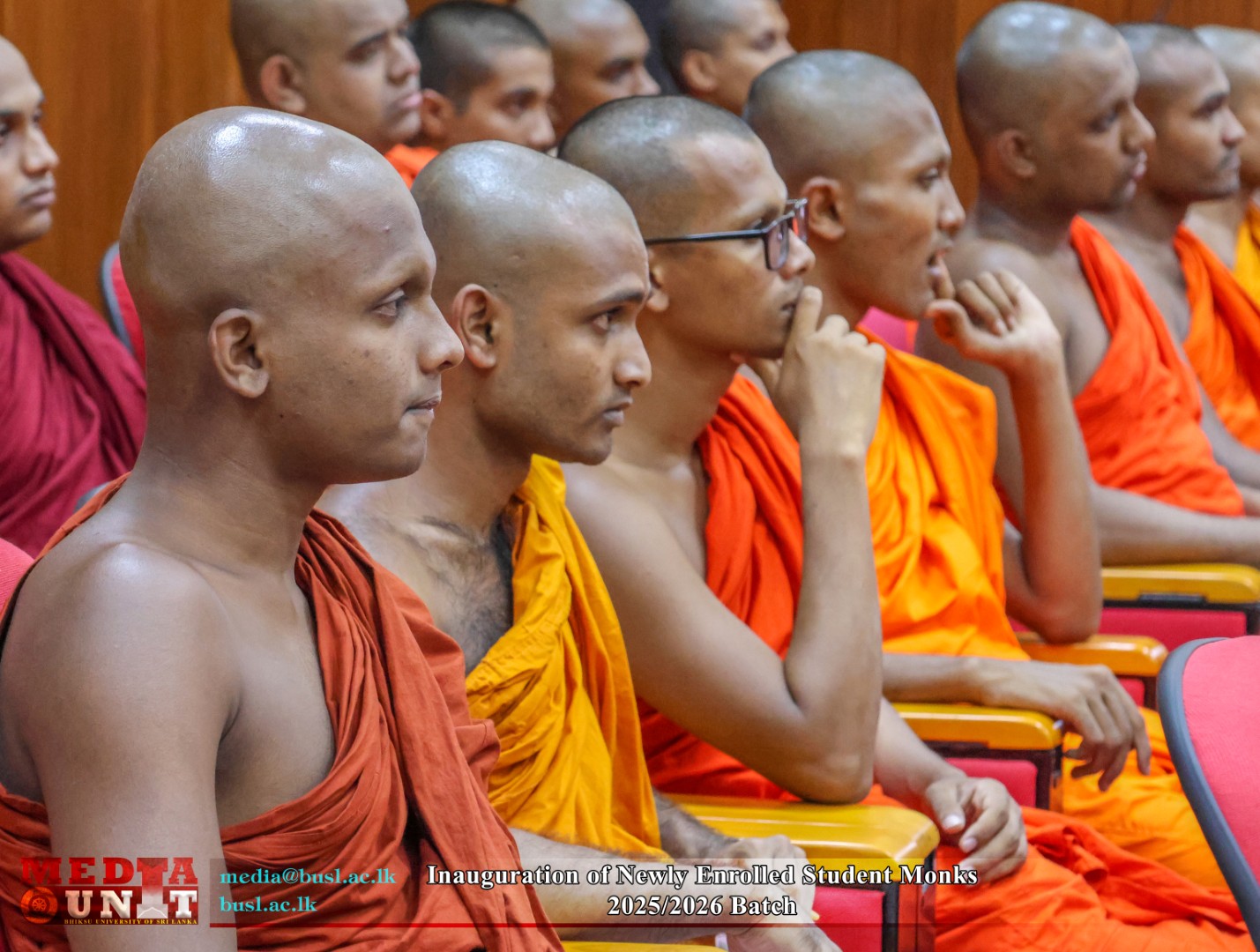 Newly enrolled student monks seated in the auditorium